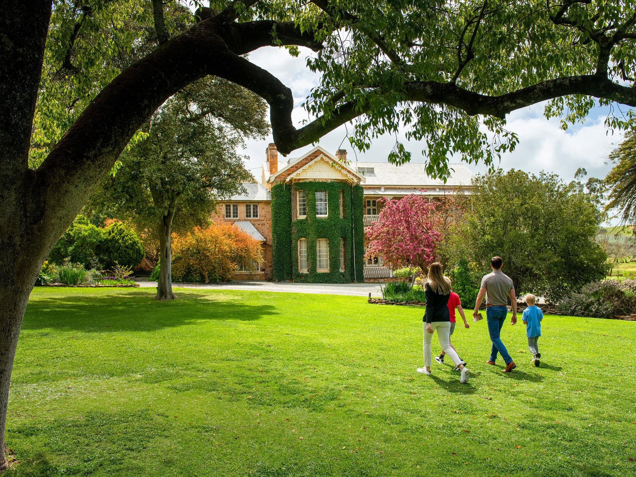 Family exploring the Homestead Gardens at Bungaree, Clare Valley SA